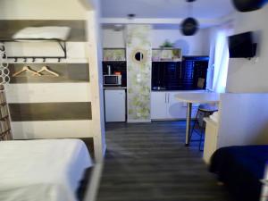 a small room with a bunk bed and a table at Barcelo Appart'hotel in Barcelonnette