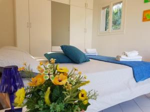 a bedroom with a bed with flowers on it at Villino I Sugheri in Marciana Marina