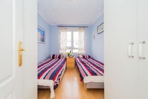 Łóżko lub łóżka w pokoju w obiekcie ALEGRIA ID106