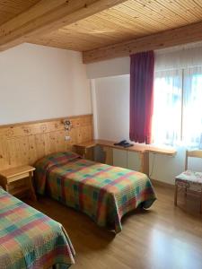 Postel nebo postele na pokoji v ubytování Albergo Ristorante Baraglia