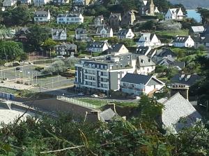 an aerial view of a town with houses at Résidence Le poisson d'or in Perros-Guirec