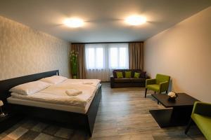 A bed or beds in a room at KMK Penzión