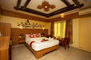 a bedroom with a large bed in a room at Hotel Splendid View in Pokhara