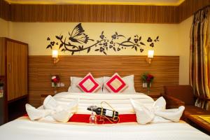 a hotel room with two beds with a camera on it at Hotel Splendid View in Pokhara