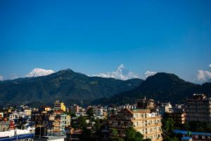 a view of a city with mountains in the background at Hotel Splendid View in Pokhara