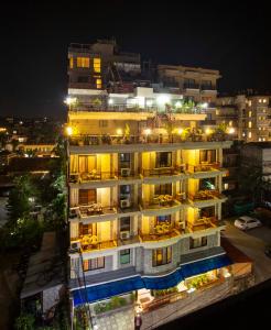 a building with lights on in a city at night at Hotel Splendid View in Pokhara
