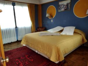 Postel nebo postele na pokoji v ubytování Hotel Utama