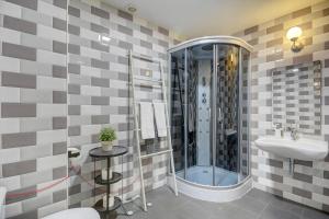 a bathroom with a shower and a sink at Inn Bairro Alto BA Sweet in Lisbon +118 photos