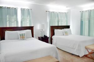 Postel nebo postele na pokoji v ubytování Beach Park Hotel