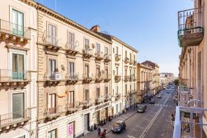 a view of a city street with buildings at Ferrini Home - Etnea Collection in Catania