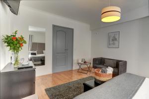 a living room with a couch and a room with a bedroom at Inn Bairro Alto BA Sweet in Lisbon