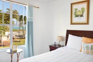 Postel nebo postele na pokoji v ubytování Beach Park Hotel