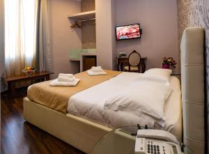 Кровать или кровати в номере Antico Hotel Moderno