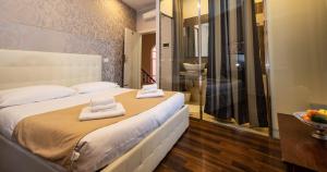 a hotel room with a bed and a window at Antico Hotel Moderno in Piombino