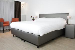 Katil atau katil-katil dalam bilik di Hotel Duinrand Drunen