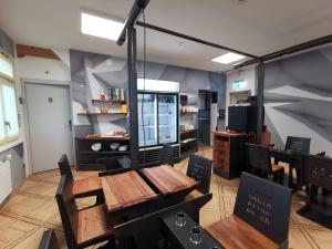 a dining room with wooden tables and chairs at Boutique Hotel BS16 before Bern City Parking gratis in Bern