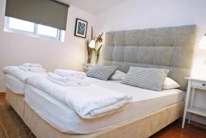 Łóżko lub łóżka w pokoju w obiekcie Hotel Delfin