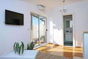 Telewizja i/lub zestaw kina domowego w obiekcie Hotel Delfin