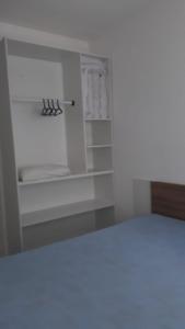 Uma cama ou camas num quarto em Apartamento na Praia Grande - Ubatuba