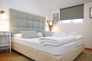 Łóżko lub łóżka w pokoju w obiekcie Hotel Delfin