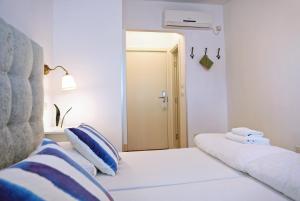 Łóżko lub łóżka w pokoju w obiekcie Hotel Delfin