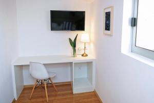 Telewizja i/lub zestaw kina domowego w obiekcie Hotel Delfin