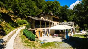 a house with a tent in front of it at Mulìn Turcìn in Coassolo Torinese +26 photos