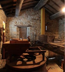 a room with a stone building with a sink in it at Mulìn Turcìn in Coassolo Torinese