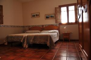 Posteľ alebo postele v izbe v ubytovaní Casa Rural "Casa Isla del Zújar"