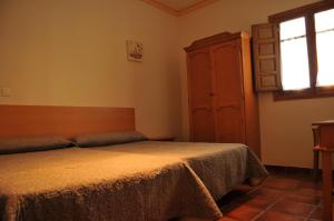 Posteľ alebo postele v izbe v ubytovaní Casa Rural "Casa Isla del Zújar"