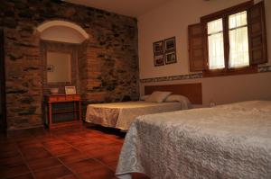 Posteľ alebo postele v izbe v ubytovaní Casa Rural "Casa Isla del Zújar"