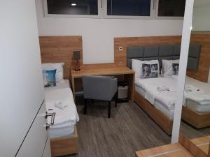 Krevet ili kreveti u jedinici u okviru objekta Pension Central Semmering
