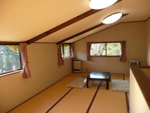 a living room with a table and two chairs in it at Myoko - Hotel / Vacation STAY 24124 in Myoko