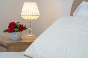 A bed or beds in a room at La Casa di Linda
