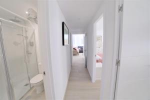 Łóżko lub łóżka w pokoju w obiekcie APARTAMENTO RIALTO 2