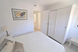 Łóżko lub łóżka w pokoju w obiekcie APARTAMENTO RIALTO 2