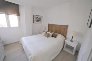 Łóżko lub łóżka w pokoju w obiekcie APARTAMENTO RIALTO 2