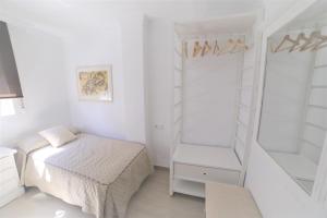Łóżko lub łóżka w pokoju w obiekcie APARTAMENTO RIALTO 2