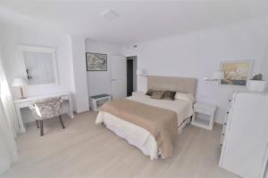 Łóżko lub łóżka w pokoju w obiekcie APARTAMENTO RIALTO 2