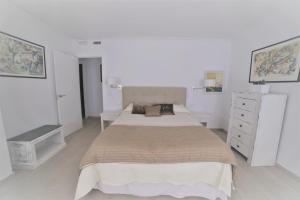 Łóżko lub łóżka w pokoju w obiekcie APARTAMENTO RIALTO 2