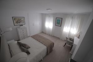 Łóżko lub łóżka w pokoju w obiekcie APARTAMENTO RIALTO 2