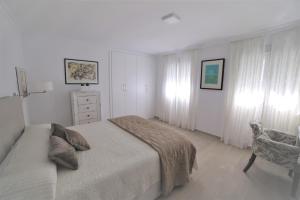 Łóżko lub łóżka w pokoju w obiekcie APARTAMENTO RIALTO 2