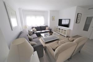 Telewizja i/lub zestaw kina domowego w obiekcie APARTAMENTO RIALTO 2