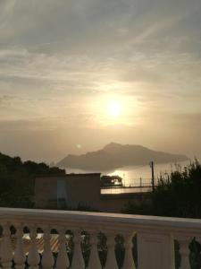 a view of the sunset from the balcony of a house at Il Profumo di Capri in Massa Lubrense