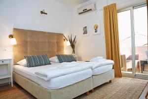 Łóżko lub łóżka w pokoju w obiekcie Hotel Delfin