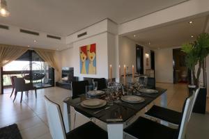 a dining room with a table and chairs and a dining room at Sweet Jacob's Appartment Gueliz City Center in Marrakech