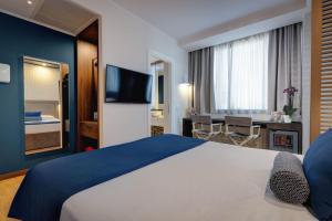 TV a/nebo společenská místnost v ubytování Fly Decó Hotel