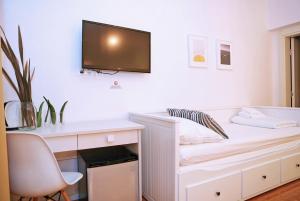 Telewizja i/lub zestaw kina domowego w obiekcie Hotel Delfin