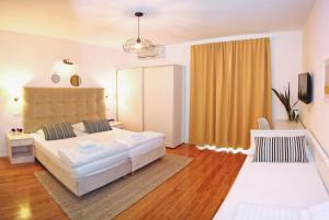 Łóżko lub łóżka w pokoju w obiekcie Hotel Delfin