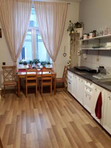 a kitchen with a table and a dining room at Stacja Centrum in Częstochowa